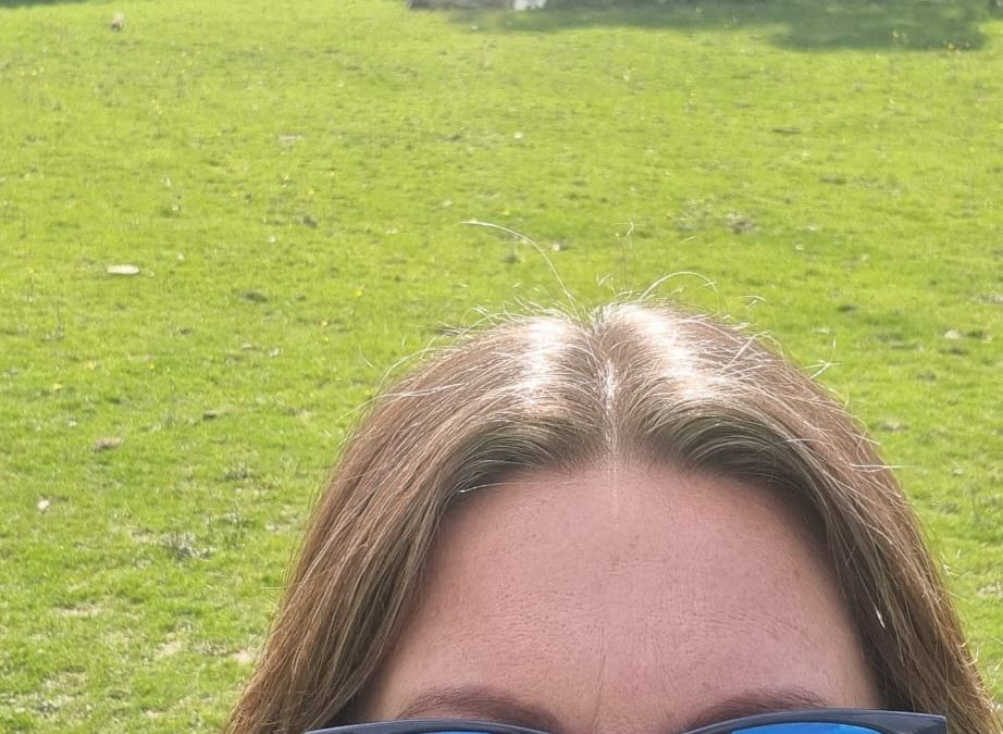 Gini in field with sunglasses